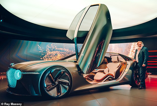 Production of Bentley's first electric vehicle has been delayed by a year - from 2025 to the end of 2026 - due to weaker-than-expected customer demand, fueled by a shortage of public charging stations. Ray Massey poses with the Bentley EXP 100 GT electric concept car
