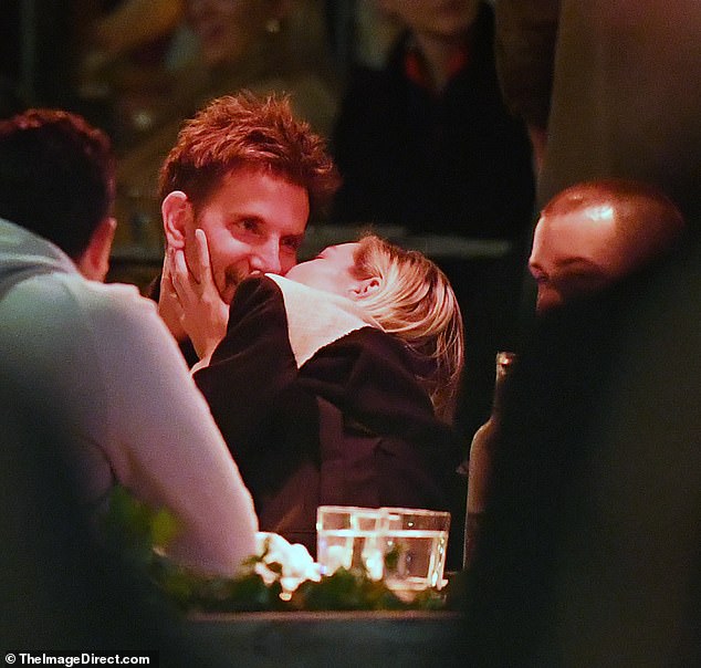 Bradley Cooper and Gigi Hadid turned up the heat on their relationship as they dined with friends on Thursday in New York