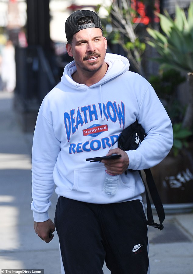 While heading into his sports bar, Jax's Bar, in Los Angeles, the reality star, 35, and father-of-one, 44, wore the colors of the Kentucky Wildcats, blue and white.