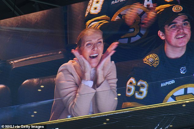 Celine Dion stepped out full of team spirit as she made a rare appearance at the Boston Bruins vs New York Rangers hockey game with her twin sons on Thursday.