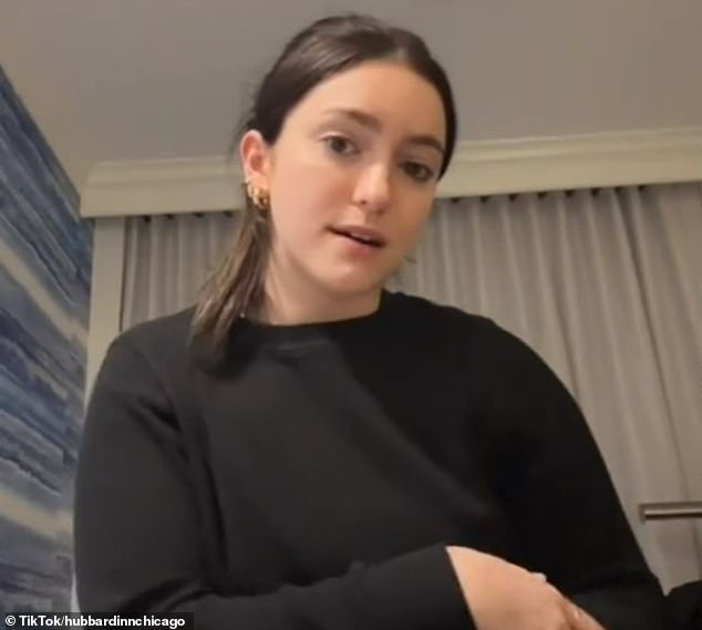 Julia Reel (pictured), a 22-year-old TikToker, is being sued for claiming a Chicago restaurant bouncer 'roughed' her and threw her down the stairs after CCTV showed her being escorted away safely.
