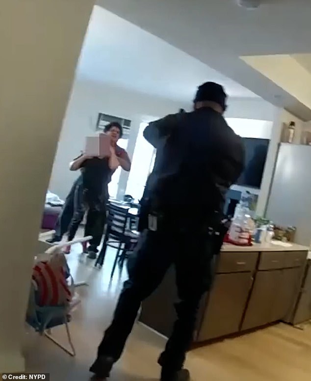 Officer Alex Morgese can be seen on his partner's body camera pointing a gun at Michael Dotel, 30, while he holds his mother in a chokehold.