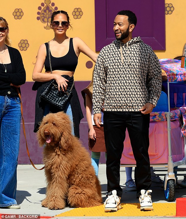 Chrissy and John Legend looked happy to support seven-year-old Luna and help the adorable tot set up shop on Melrose Ave