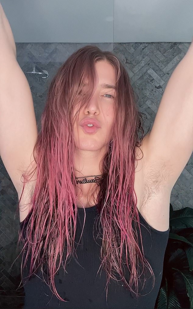 In exclusive photos obtained by Daily Mail Australia, Christian dyed his long hair hot pink for the LGBTQI+ pride event in Sydney.