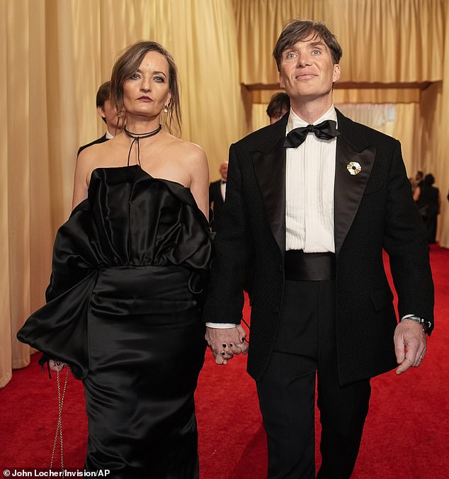 Cillian Murphy's wife channeled dark glamor as she wore an inky black dress to Sunday's Oscars in Los Angeles