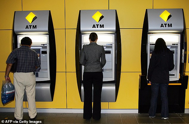 Customers were left outraged by the decision to reject the transfer when an image of the statement provided by the bank was uploaded to social media (pictured people withdrawing cash at an ATM).