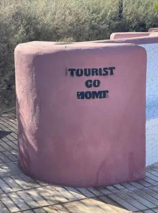 'TOURIST COMES HOME': Graffiti has appeared in the Canary Islands telling tourists to 'go home' and accusing tourists of bringing 'misery' to locals