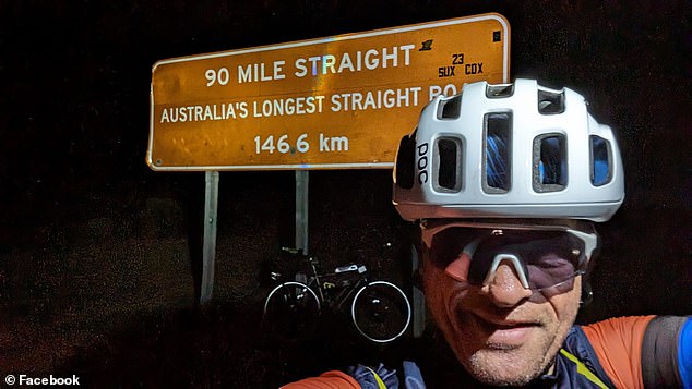 Mr Barker was allegedly hit by a truck on the highway during the 2024 Indian Pacific Wheel Race (pictured, Mr Barker entering the Eyre Highway)