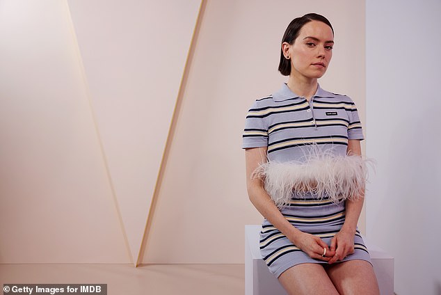 The actress, 31, looked nothing short of sensational as she donned a striped Miu Miu ensemble that included a feathered polo crop top and mini skirt.