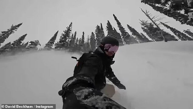 David Beckham face plants the ground while snowboarding with son