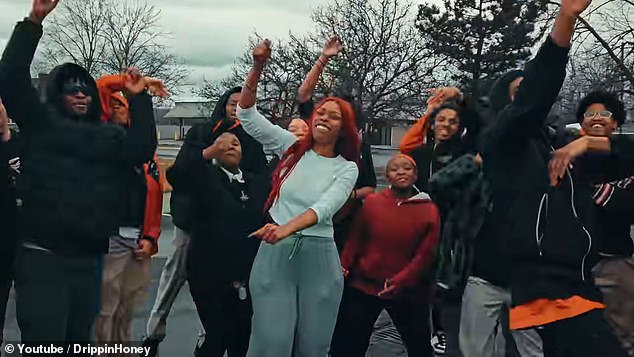 A Detroit high school history teacher lost her job after parents complained about her 'side hustle' as a rapper and now plans to take legal action against the school