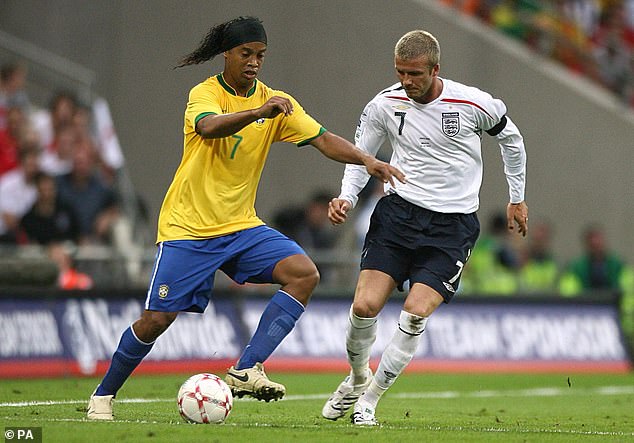 England's David Beckham closely watches Brazil's Ronaldinho during the 2007 friendly match.