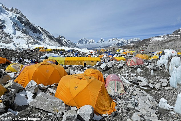 Officials are concerned that the base camp (pictured), which sits 17,598 feet high on the Himalayan mountainside, is becoming too crowded amid a surge in visitor numbers.