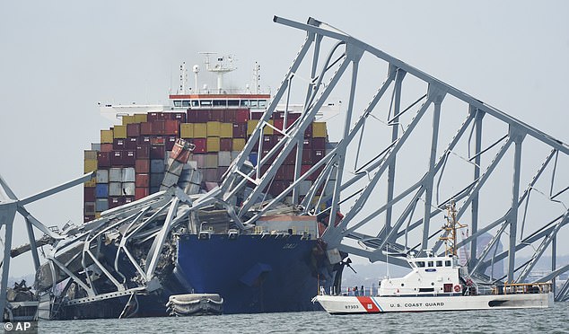 Multiple alarms sounded aboard the doomed Dali freighter in the minutes before it collided with Baltimore's Key Bridge (pictured the morning after Tuesday's impact).