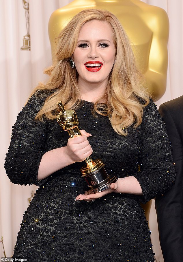 Adele is one of the most famous stars one win away from achieving EGOT status, as the acronym stands for Emmy, Grammy, Oscar and Tony Awards, and she only lacks a Tony Award;  she is pictured accepting an Oscar in 2013