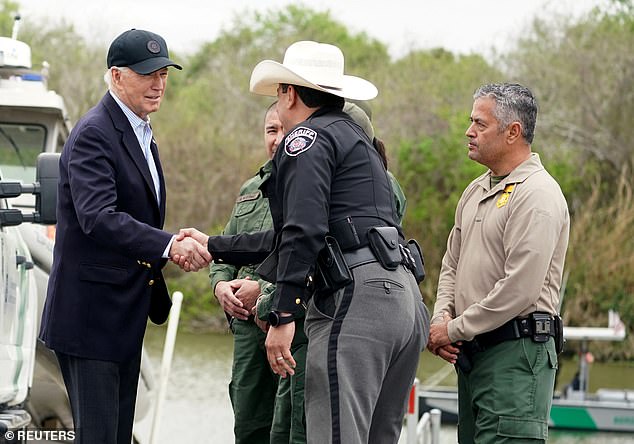US President Joe Biden greets a member of law enforcement while receiving a briefing at the US-Mexico border in Brownsville, Texas, on February 29.