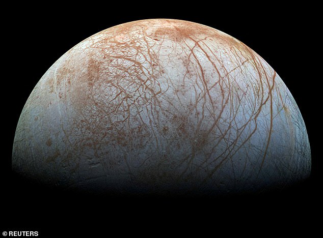Even highly advanced extraterrestrial civilizations could find themselves without the resources - or key information - needed to escape their home world, according to a study from Spain's Mid-Atlantic University.  Above, Jupiter's watery moon Europa, photographed by NASA's Galileo spacecraft.