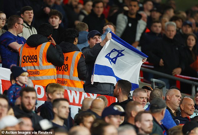 An Israeli flag was spotted inside Wembley during the England-Australia match last October, despite a ban in place, and security officers were pictured approaching the man who displayed it.