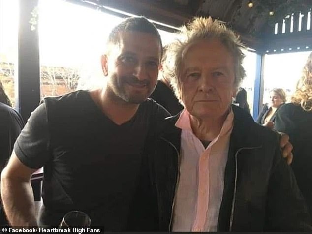 Legendary Australian filmmaker and Heartbreak High creator Michael Jenkins (right) has died aged 77. The industry icon was diagnosed with Parkinson's disease in 2020 and died in Sydney on March 4.  Pictured with actor Salvatore Coco