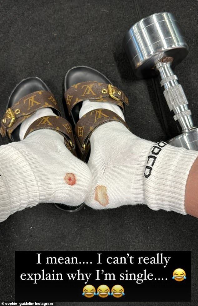 The fitness influencer, 34, took to her Instagram stories to share a photo of her bleeding feet at the gym and her bizarre choice of footwear to avoid further aggravating the injury