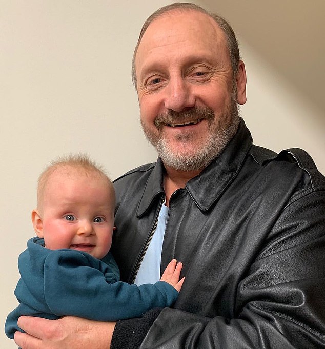 The man 'nicknamed' God by many fans (pictured with his grandson Levi) has fallen on tough times financially following his life-changing diagnosis.