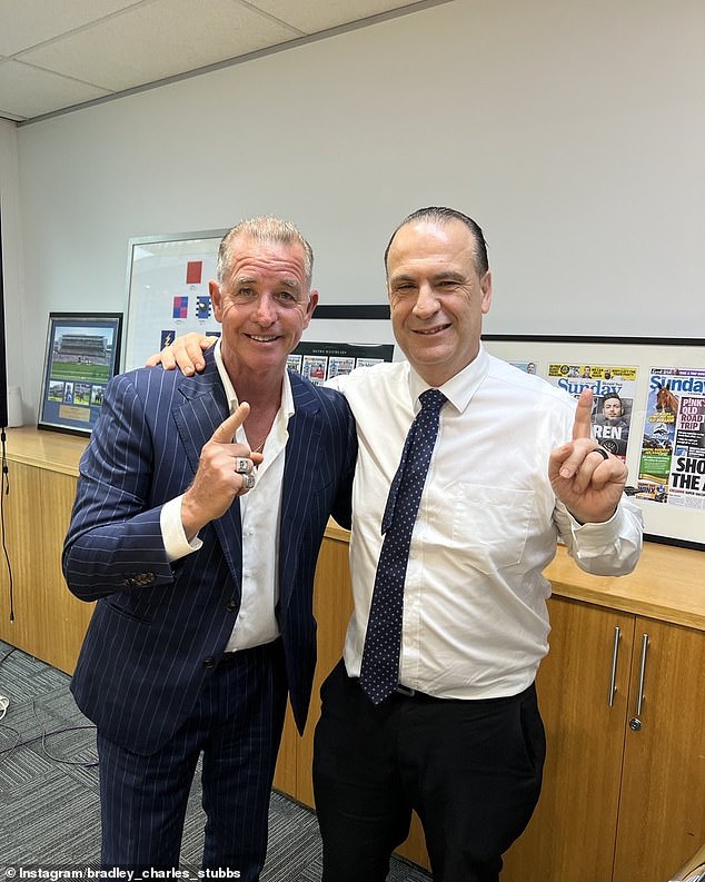 Bradley Charles Stubbs (pictured left with NRL boss Peter V'landys) wears premiership rings (on his right hand, above) after helping Trent Robinson lead the Roosters to glory