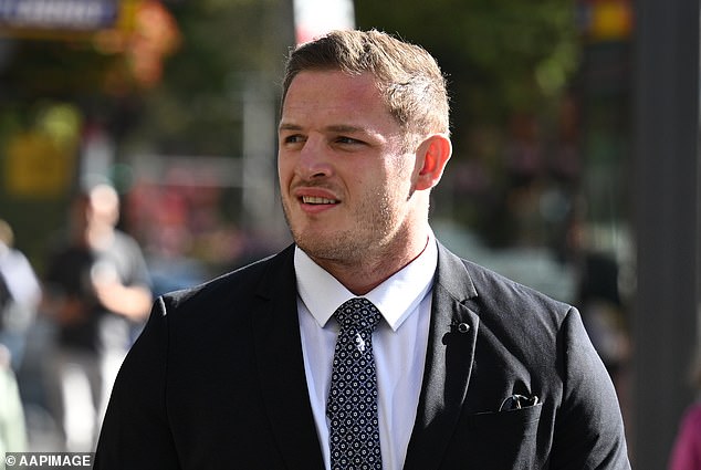 George Burgess is pictured arriving at Sydney's Downing Center Local Court where he faces charges of sexually touching a woman