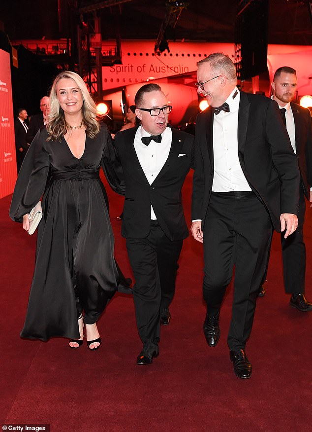 Alan Joyce resigned as Qantas boss last September. He is pictured with Anthony Albanese (right) and Albanese's partner Jodie Haydon (left).