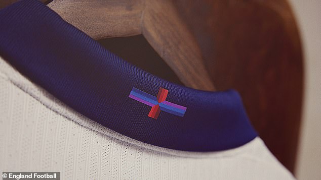 The shirt features a modified design of the St George's Cross which features a red, navy blue and purple design