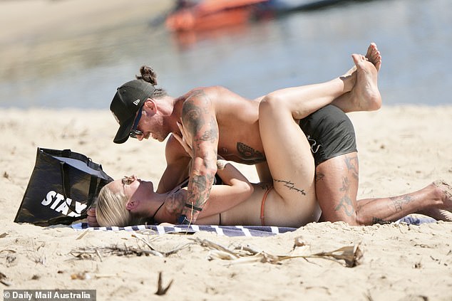Married At First Sight's Jack Dunkley and Tori Adams couldn't keep their hands off each other as they packed on the PDA during their Gold Coast beach date on Wednesday.