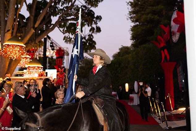 Guests were able to enjoy a horse show with riders carrying Australian and company flags.