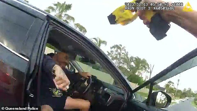 Wild footage has emerged of the moment Noah Spells, 40, jumped out of a car to attack a female officer (pictured) in Pagewood, Gold Coast, on December 13
