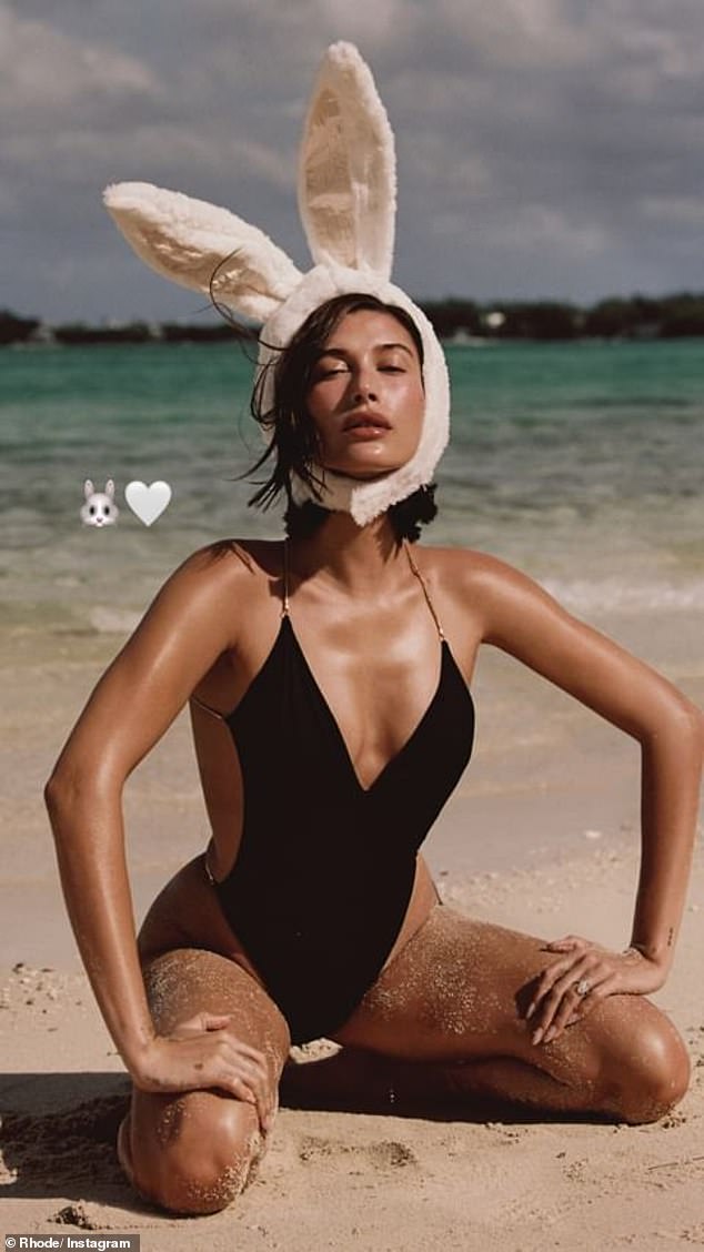 Hailey Bieber led celebrities celebrating Easter with a snap she shared on her Instagram Stories.  The Rhode Beauty founder, 27, posed on the beach in a black one-piece swimsuit with a plunging neckline.