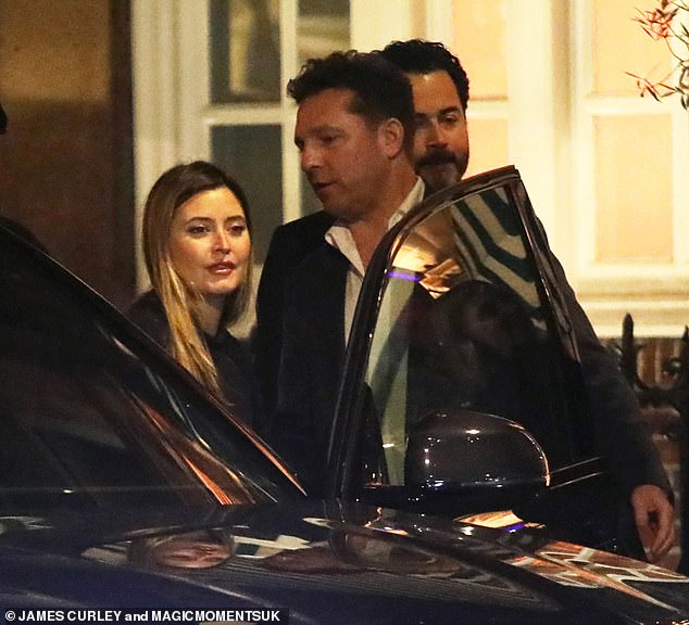 Holly Valance, 40, and her husband Nick Candy, 51, packed on the PDA after enjoying a date night at Harry's Bar in Mayfair on Wednesday