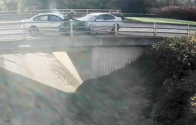 Video footage released by police shows the motorcyclist thrown over a bridge after being hit by a BMW driver (silver car on left) on Brickhill Street, Milton Keynes.