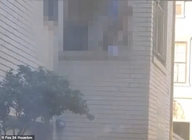 A couple is seen having sex on the balcony of a Houston Airbnb in a pixelated image provided by a horrified local resident.