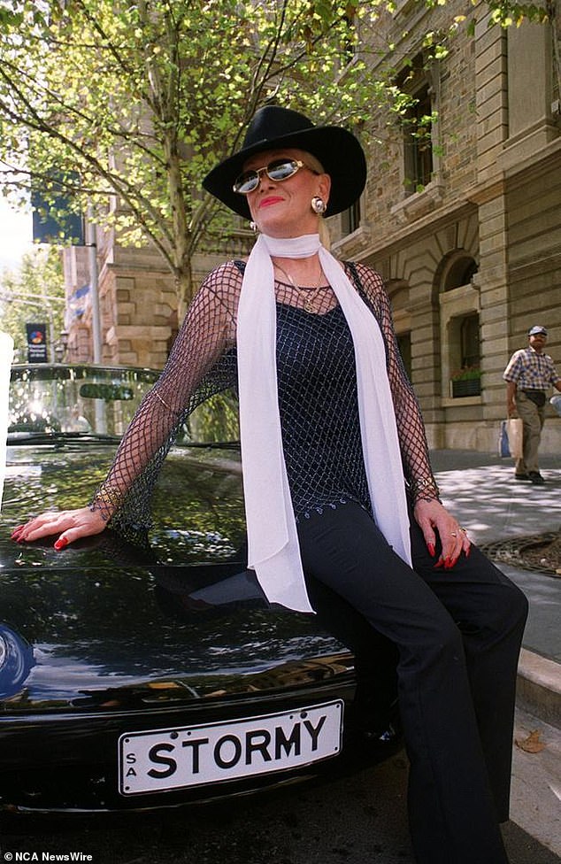Madam, brothel owner and later Adelaide City Council mayoral candidate, Stormy Summers, with her famous BMW car outside Adelaide Town Hall in 2000.