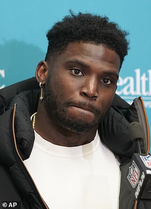 Influencer Sophie Hall, 35, claims Dolphins wide receiver Tyreek Hill, 29, broke her leg during a backyard football lesson at his Florida villa last year, but Hill says she tripped over a dog