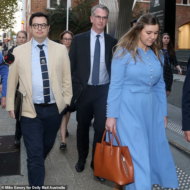 Brittany Higgins (right) and David Sharaz (left) were photographed leaving the David Malcolm Justice Center in Perth on Wednesday night after a nine-hour mediation.