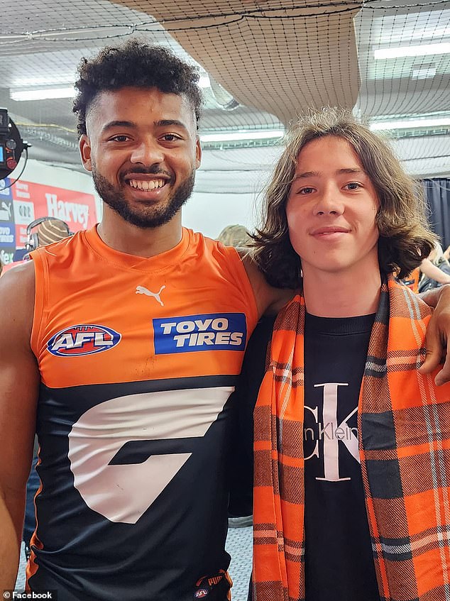 Connor Idun is pictured with his brother Tane, who went from Geelong supporter to GWS fan to cheer on his older brother.