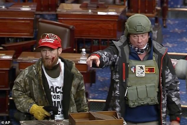 This image from Senate Television video shows Larry Brock, right, on the Senate floor at the U.S. Capitol on Jan. 6, 2021. The image was part of the case against him.