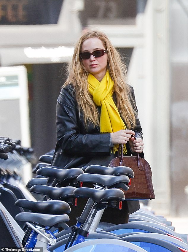 Jennifer Lawrence was spotted going for a bike ride with her husband, Cooke Maroney, on Saturday.  The 33-year-old actress looked effortlessly stylish as she bundled up in a leather jacket and bright yellow scarf for their outing in New York.