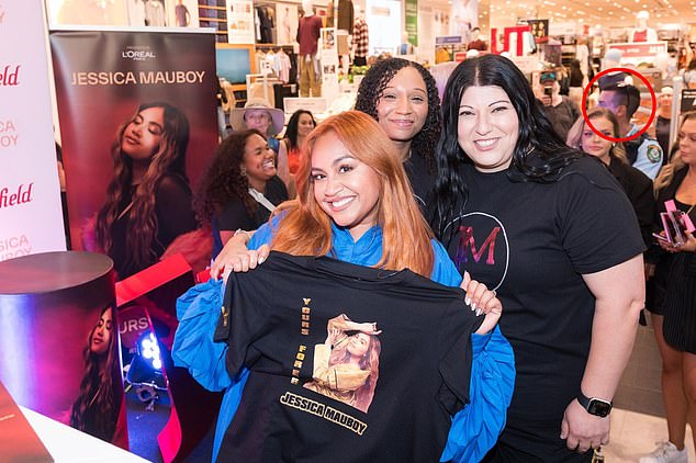 Lamarre-Condon can be seen in the background of a photo Jessica Mauboy took with her fans on February 12 at Westfield Bondi Junction.