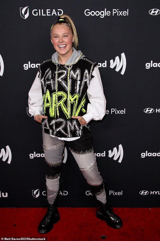 JoJo Siwa, 20, looked punk-rock cool in a shredded hoodie and jeans at the 2024 GLAAD Media Awards in Los Angeles on Thursday