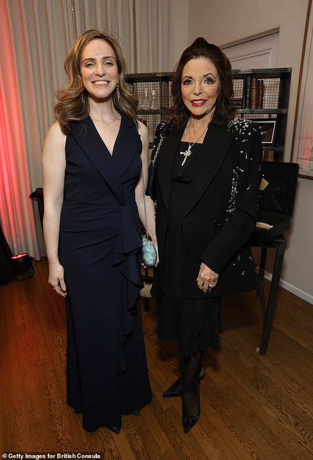 Joan wore a flowy black knee-length dress which she paired with a stunning black jacket that featured padded shoulders (pictured with Emily Cloke).