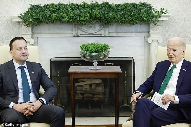 It's in the cards: President Joe Biden holds a note card for his Oval Office meeting with Irish Taoiseach Leo Varadkar