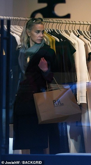 The executive producer and socialite was seen looking for his boyfriend while shopping.