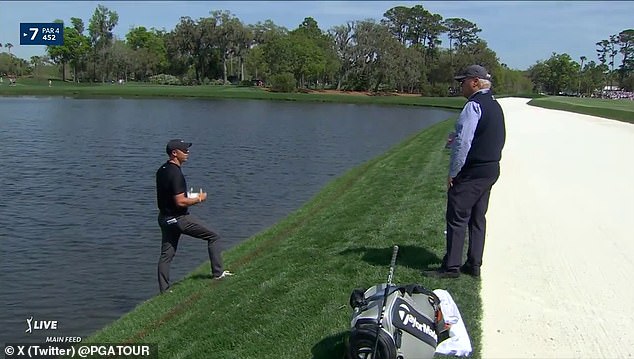 Rory McIlroy hit a drive into the water on the seventh hole, leading to an extended delay