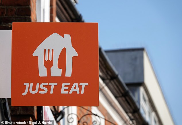 A Just Eat sign on the wall of the High Street, Billericay, Essex