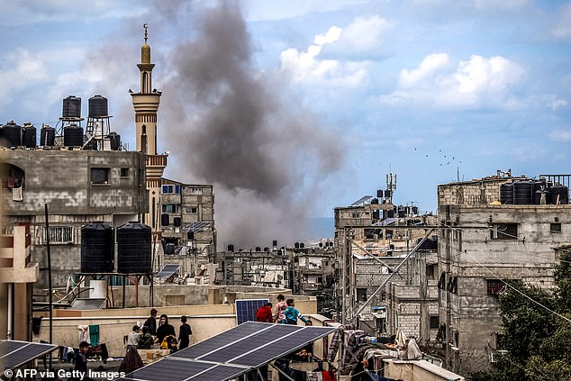 A plume of smoke erupts during Israeli shelling of a building in Rafah, southern Gaza Strip, on March 24, 2024.